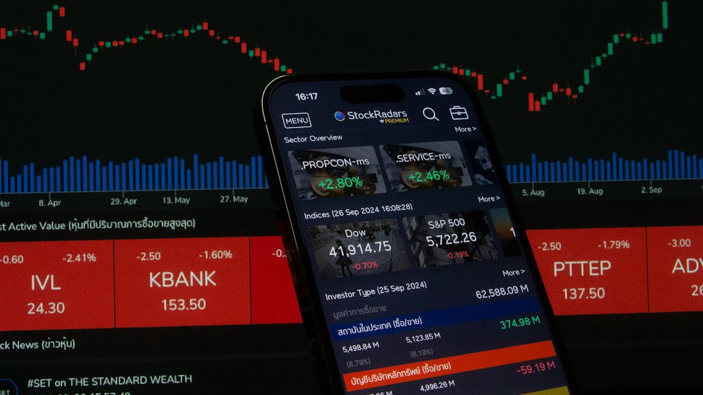 Stock Loss Tax Deduction : Close-up of a digital stock trading app interface with investment charts and market trends displayed.