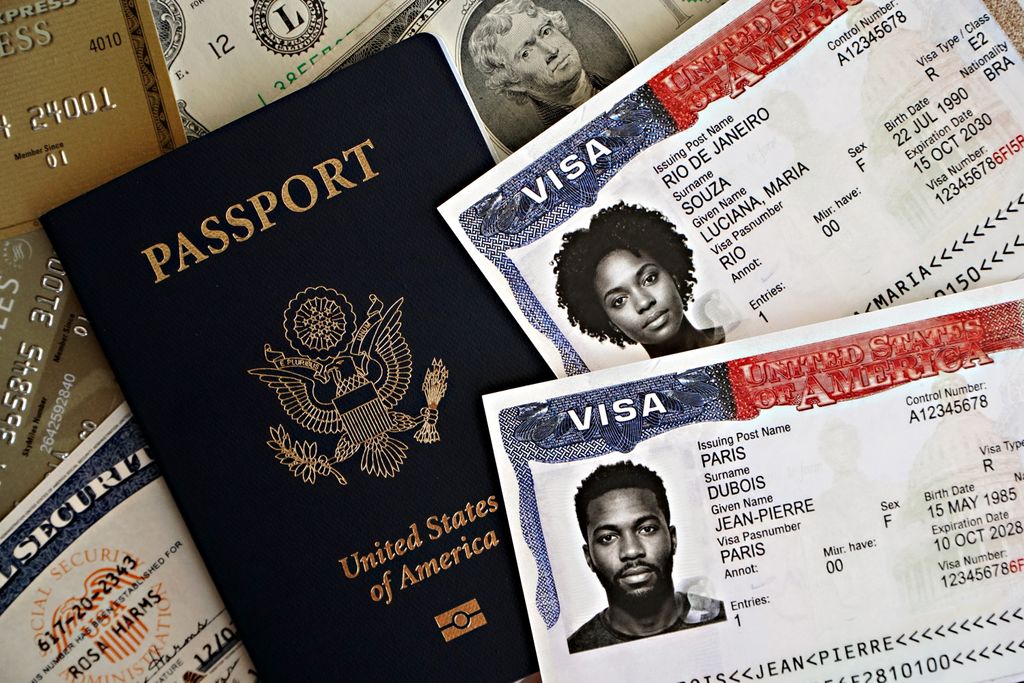 US E2 Visa Change of Status: My Honest Experience Switching Jobs on an L1 Visa 2 US E2 visa change of status: Close-up of a U.S. passport with visas and currency, symbolizing international travel and immigration.